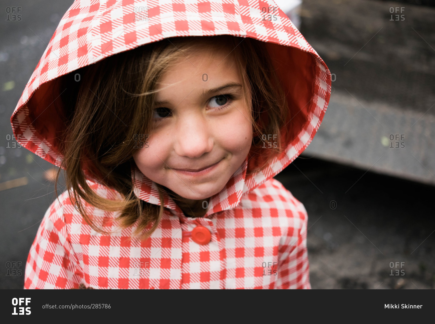 Portrait of girl with hooded rain coat