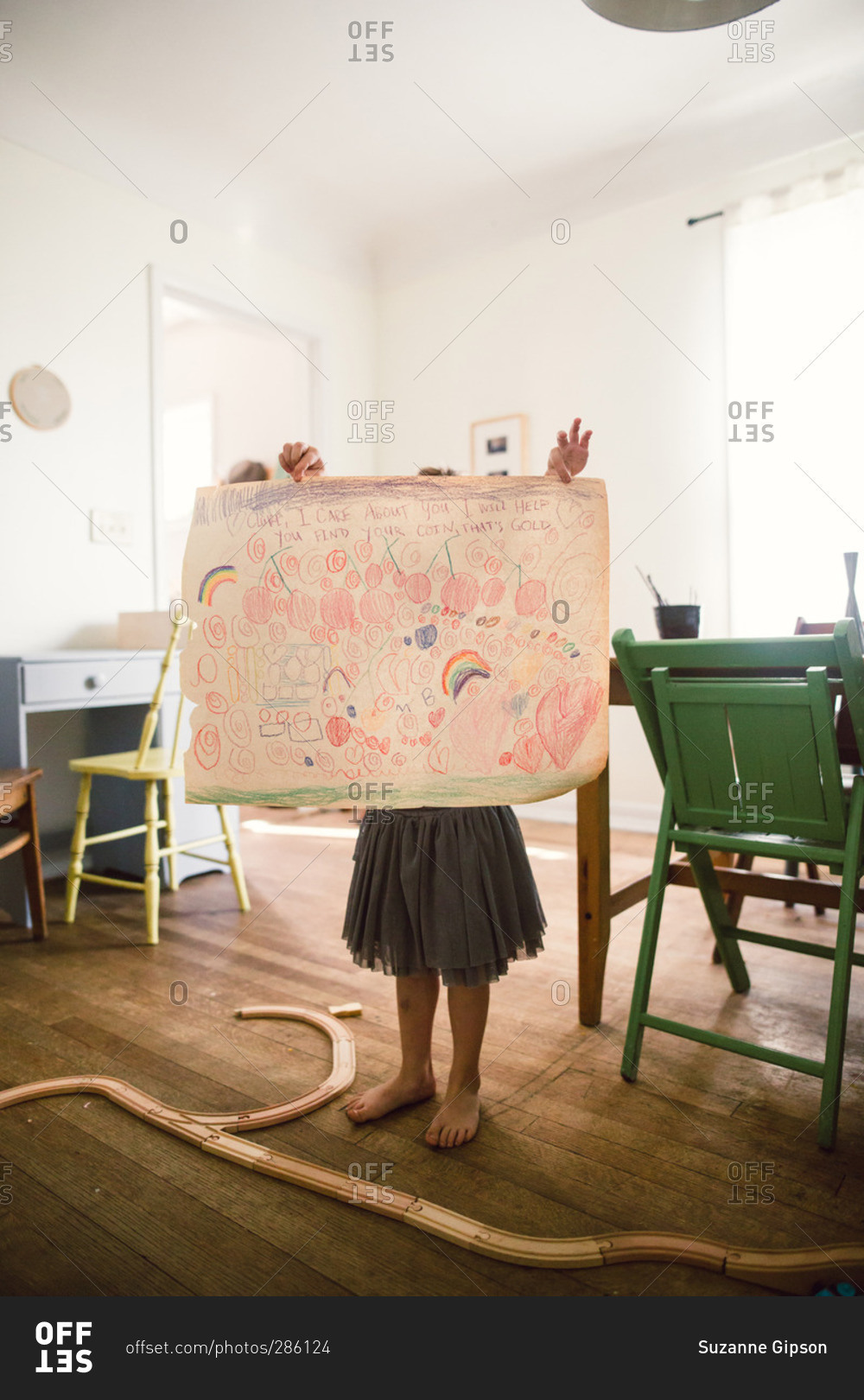 A Young girl with a picture that she drew