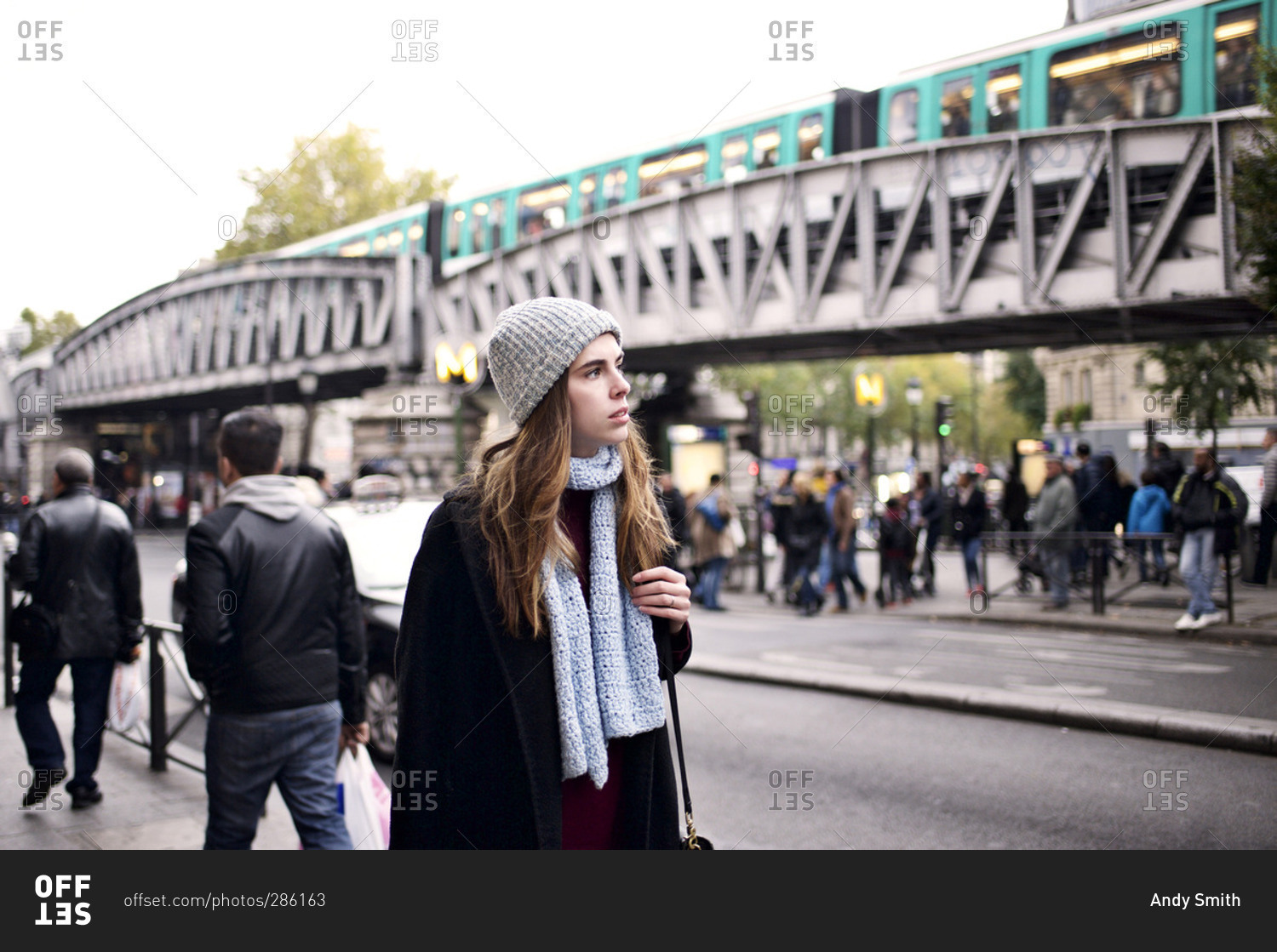 Woman in cool weather clothes walking in Paris