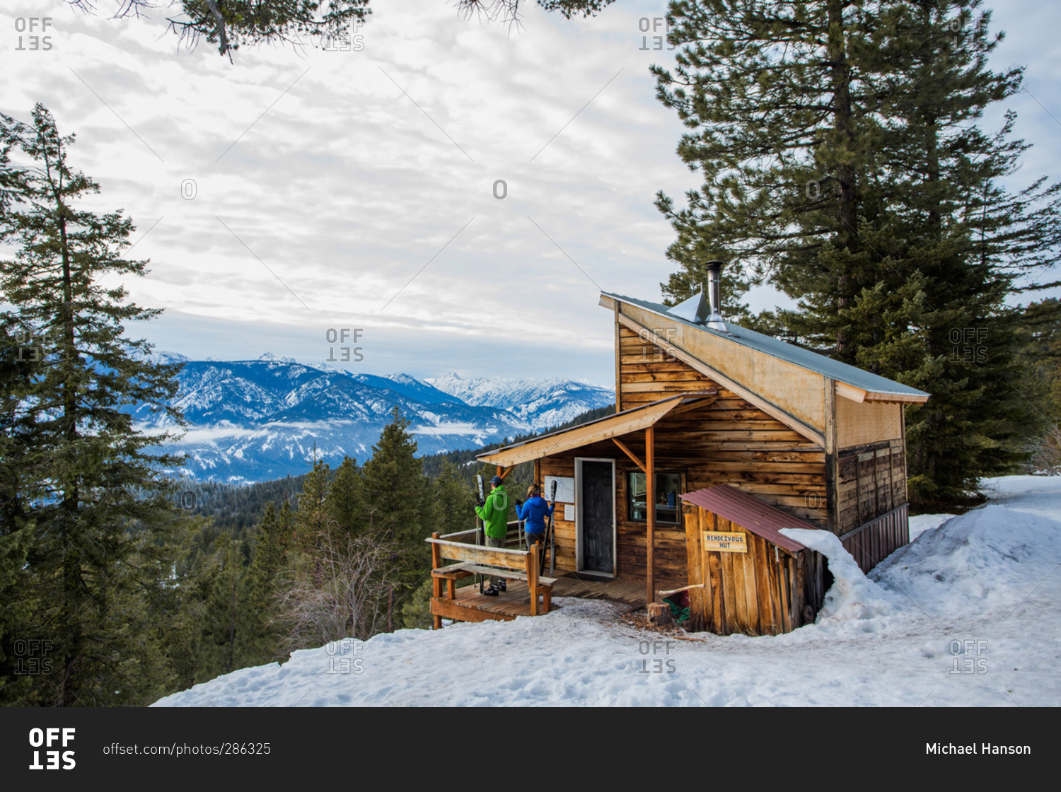 Two cross country skiers on the Mazama backcountry stop at one of the Rendezvous Huts in Washington's Methow Valley.