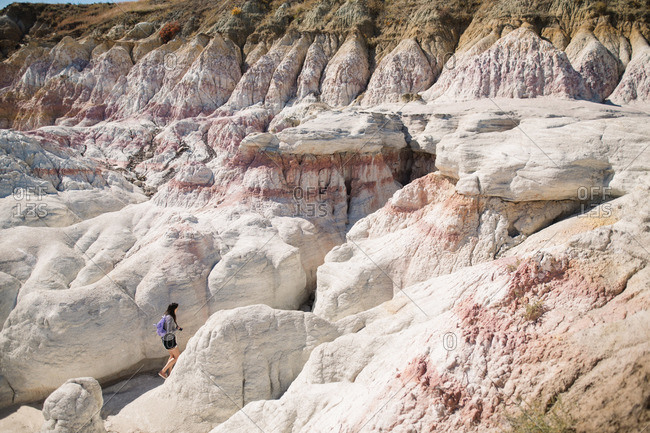 Woman in rock formations of Badlands, South Dakota