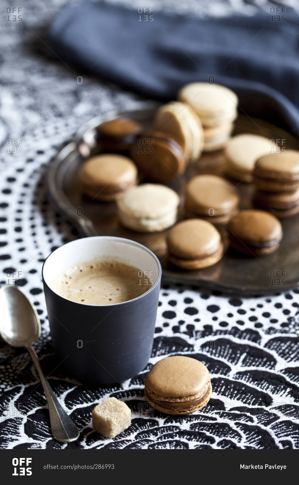 Coffee and tray of macaroons