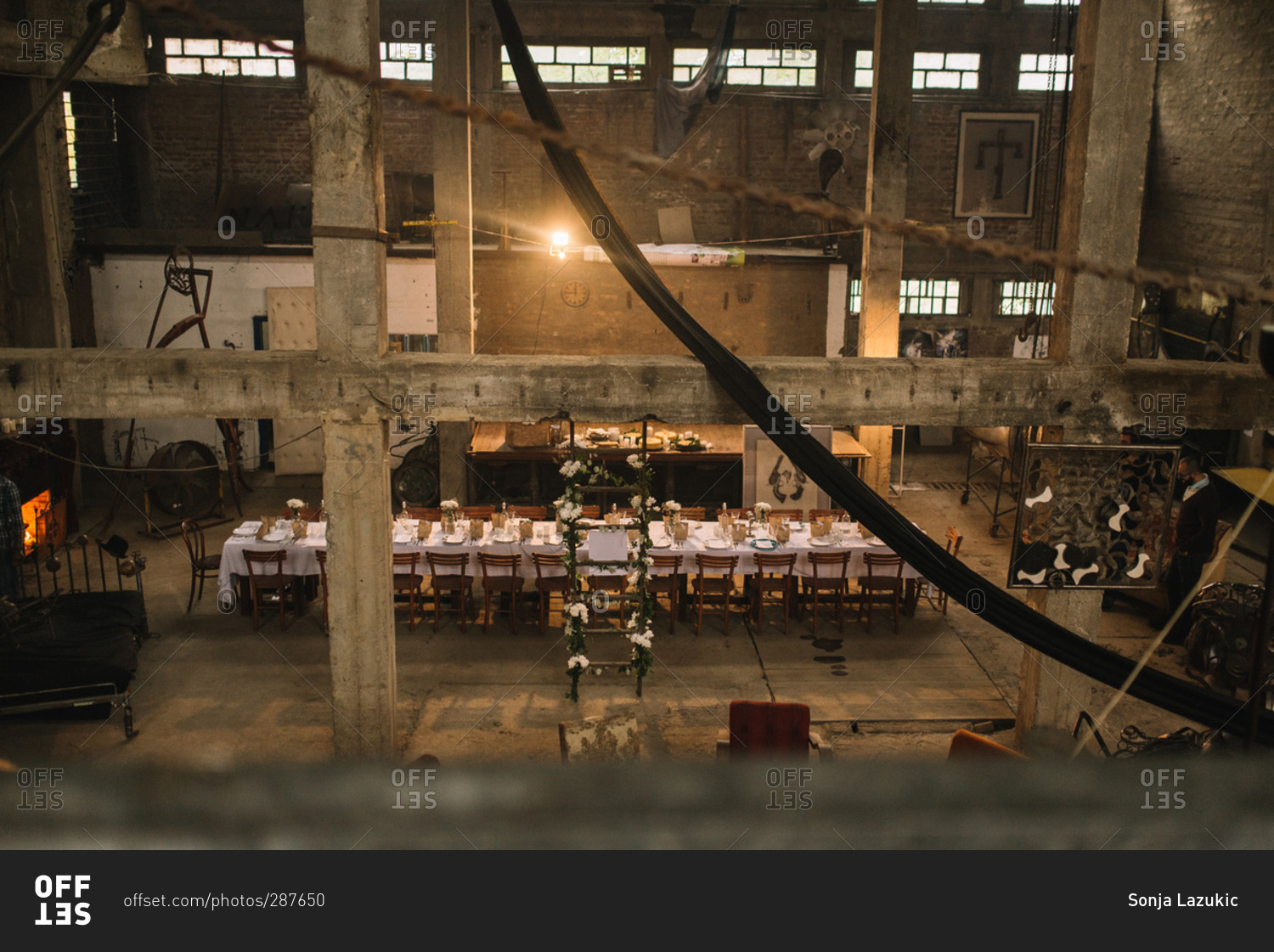 Industrial loft space set up for a dinner party
