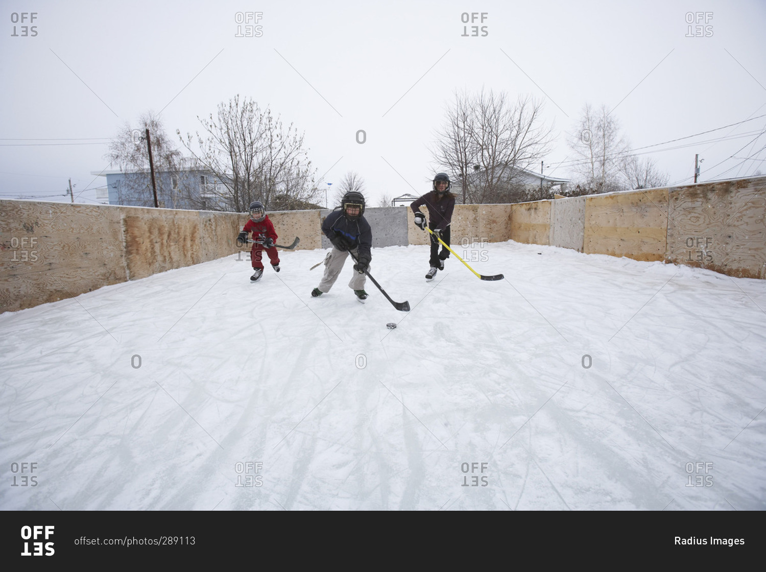 Kids Playing Ice Hockey