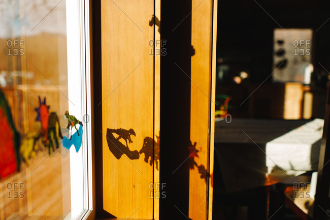Dinosaur stickers on a home's window