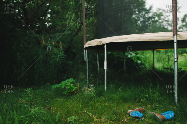 Trampoline and child's cowboy boots