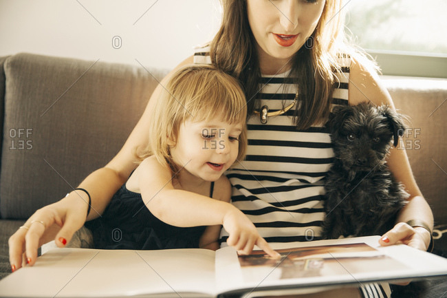 Mother and daughter looking at a photo album