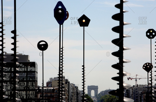 View of the Arc de Triomphe through a sculpture installation in Paris, France