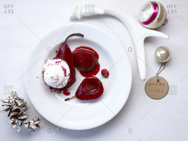 Wine, spice, and rose poached pears with holiday accents