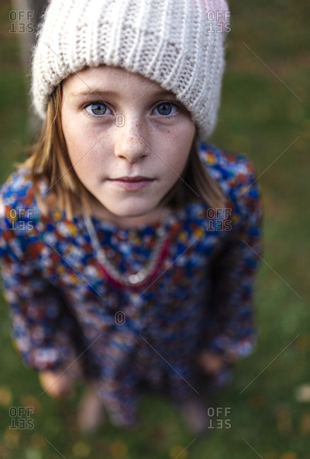 Portrait of serious looking girl wearing woolen cap