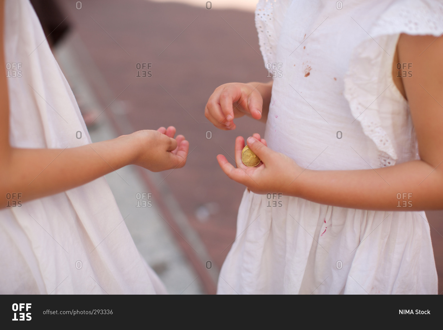Girl giving money to her sister