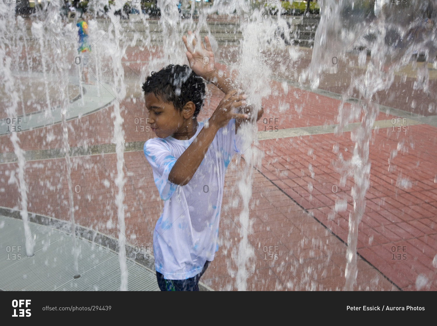 Child plays in the Centennial Park Fountain, Atlanta, GA