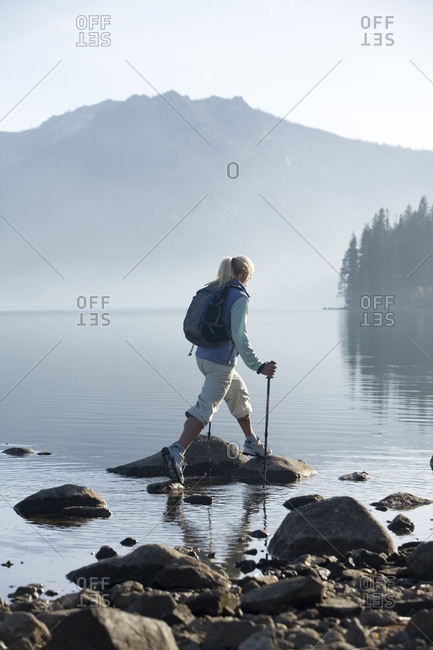 Woman hiking by Fallen Leaf Lake, Lake Tahoe, CA