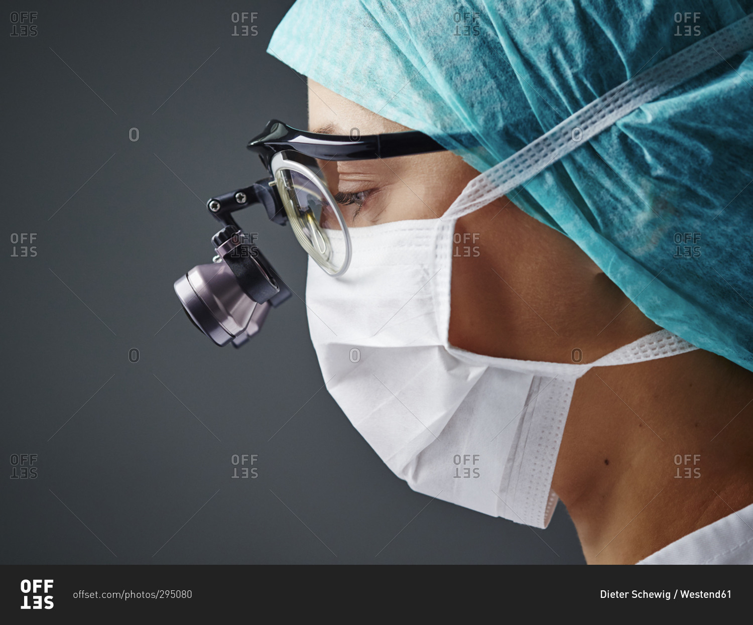 Young doctor wearing mask and magnifying spectacles