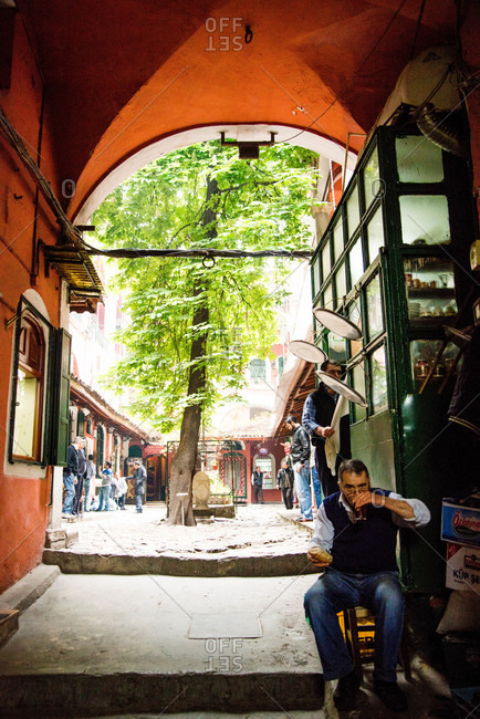 Istanbul, Turkey - May, 2014: Man having a snack near courtyard, Istanbul