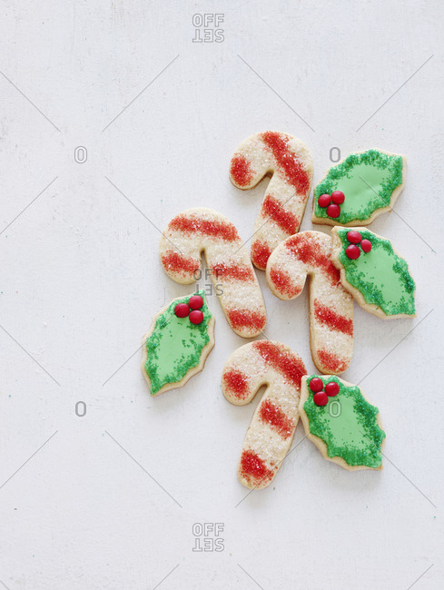 Candy cane sugar cookies with holly leaves