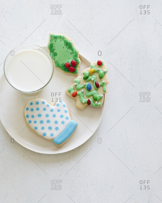 Christmas cookies on a plate with milk