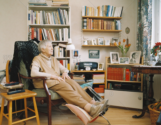 Elderly lady relaxing on chair