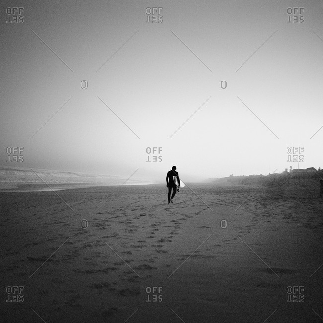 A surfer on a beach, USA