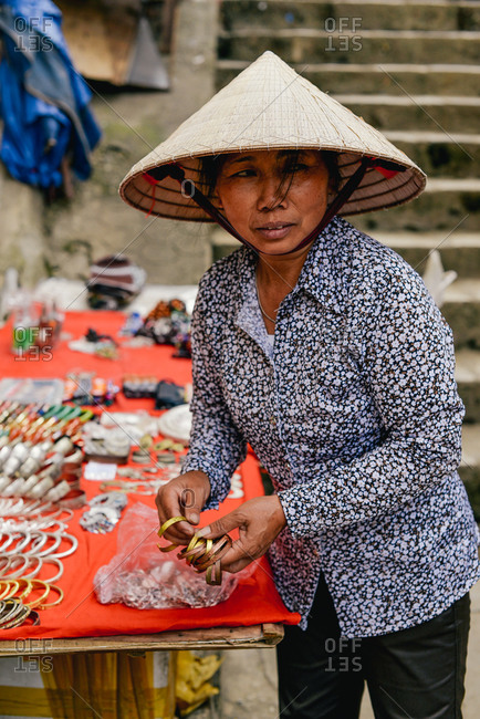 Sapa, Vietnam - July 13, 2015: A woman sells souvenirs on the streets to support her family