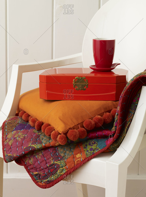 Various household items stacked on char