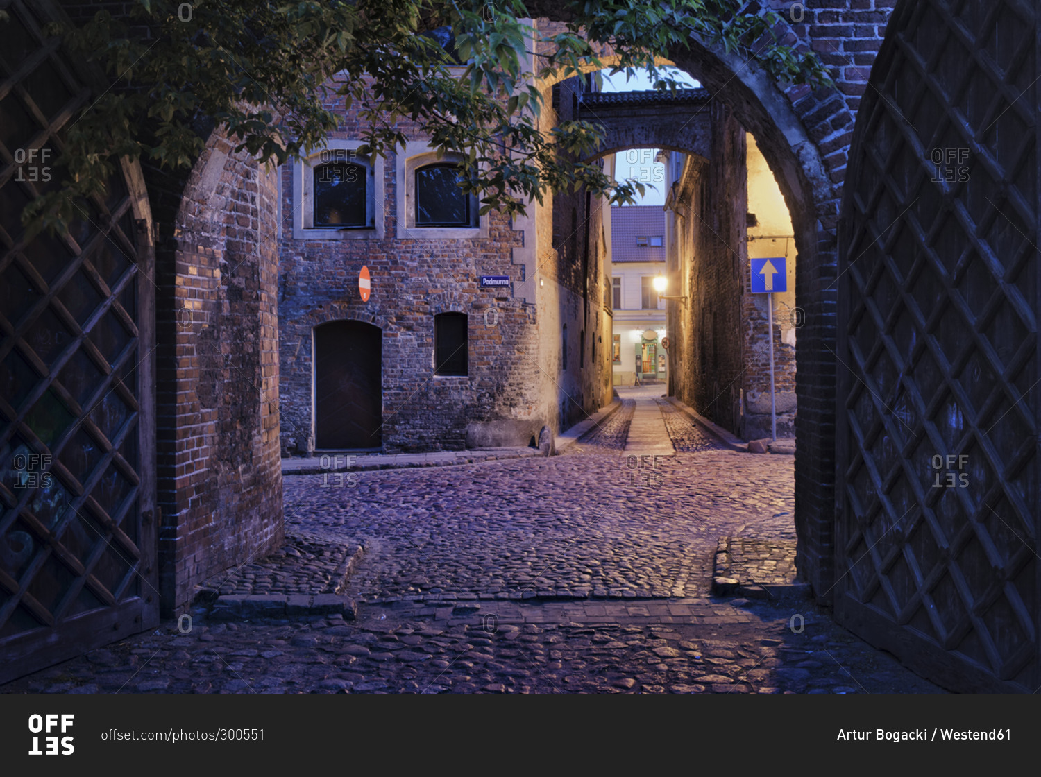 Alleys at the Medieval Old Town in the evening stock photo - OFFSET