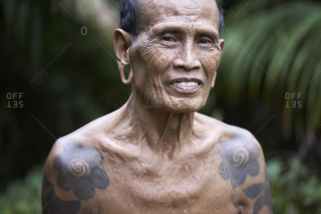 Premium Photo  Stylish elderly bearded retired man in tattoos on bright  colored background generative ai
