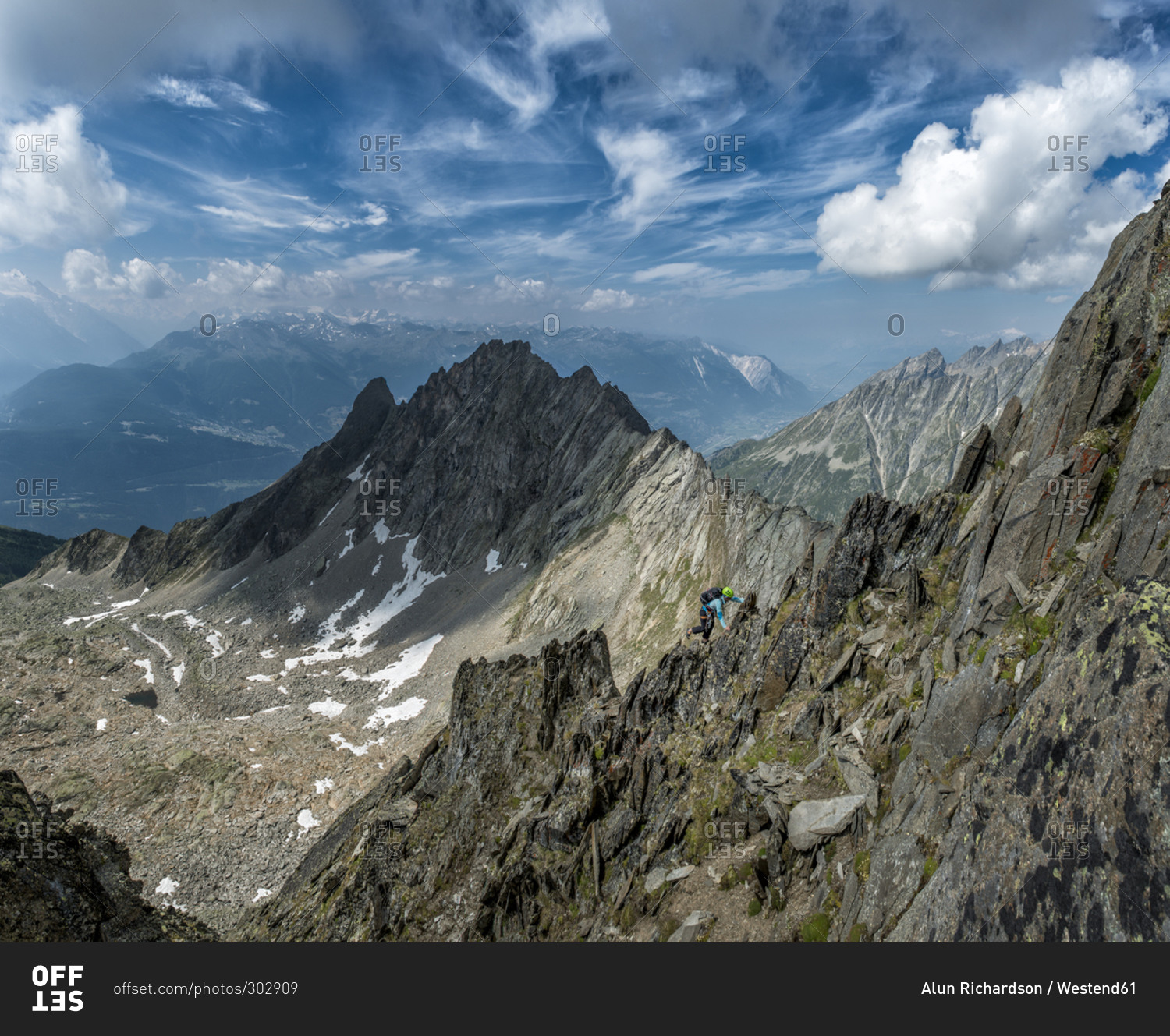 A person climbing Wiwannihorn mountain in Switzerland