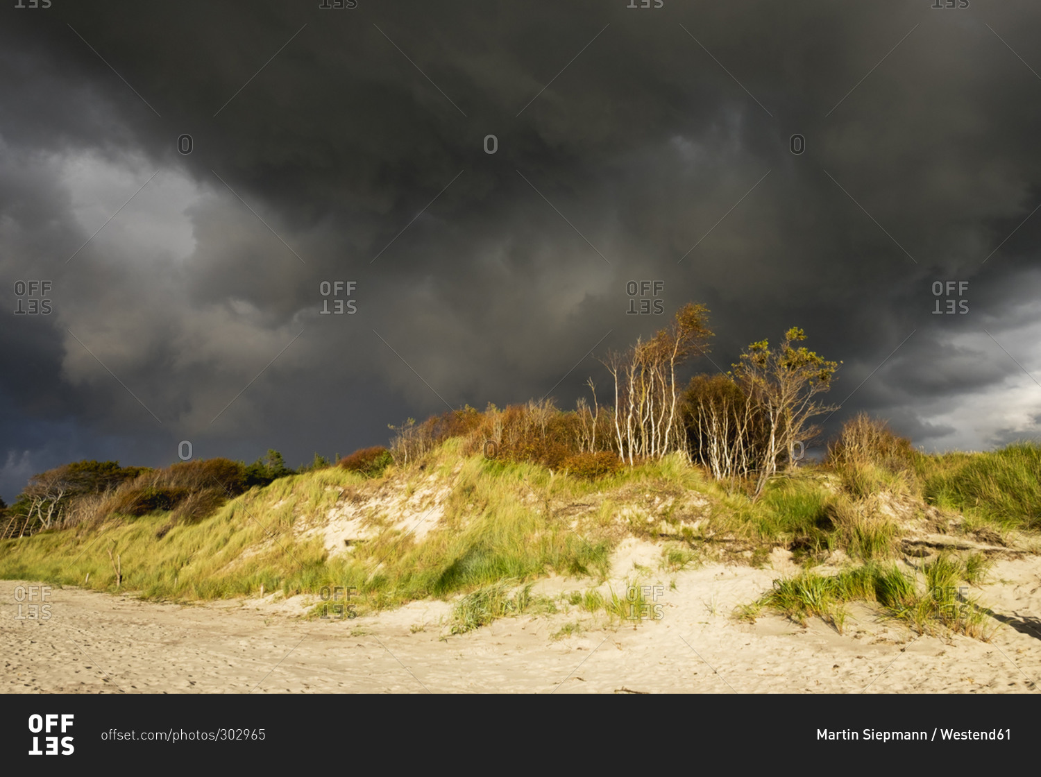 Rain clouds over Baltic Sea beach in Born auf dem Darss in Germany