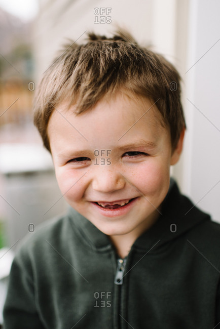 Little boy with a big toothless grin