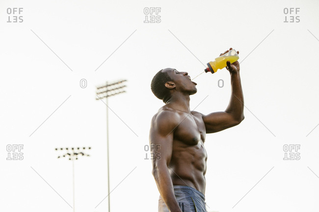 Male athlete hydrating