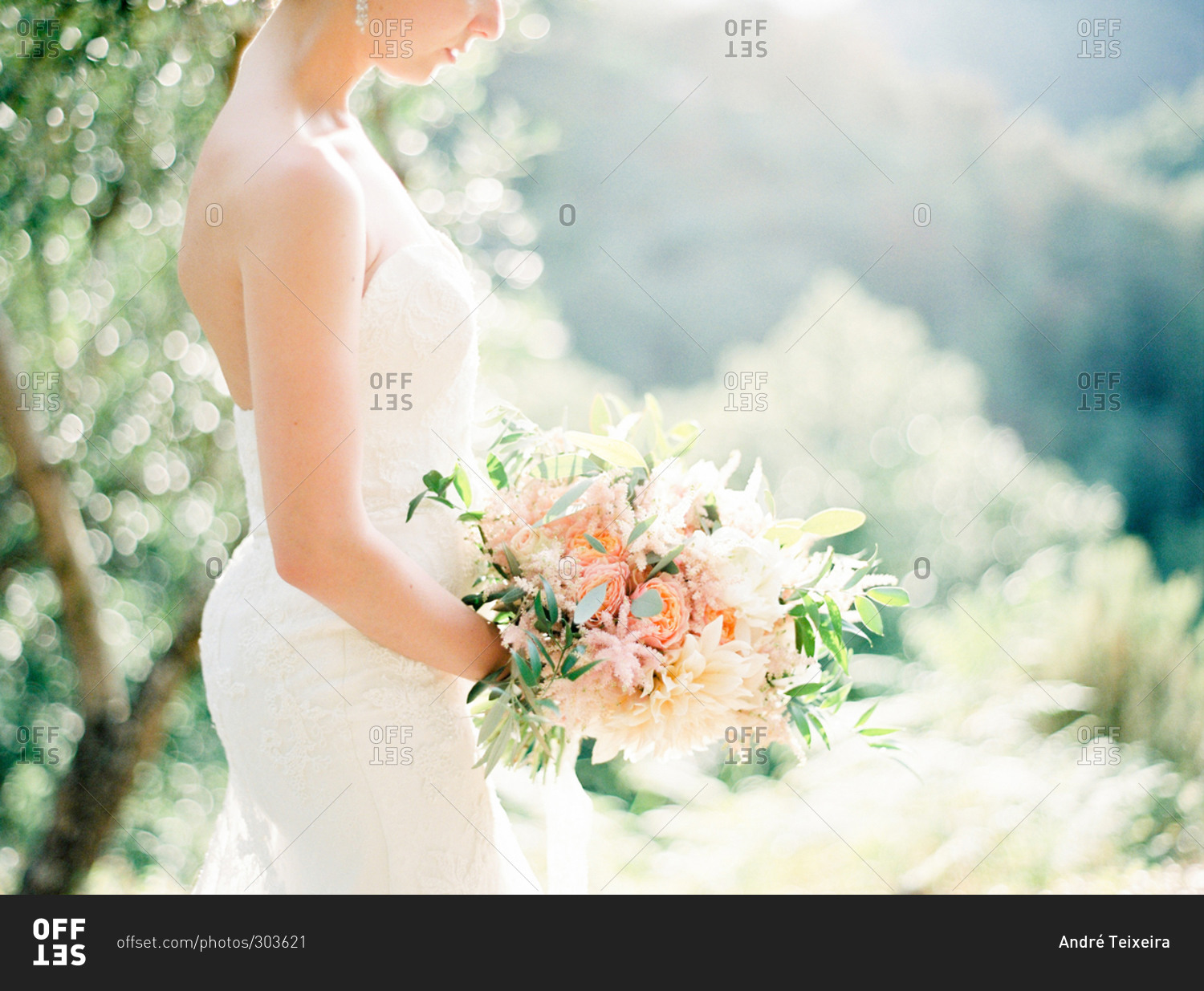 Side view of bride holding wedding bouquet