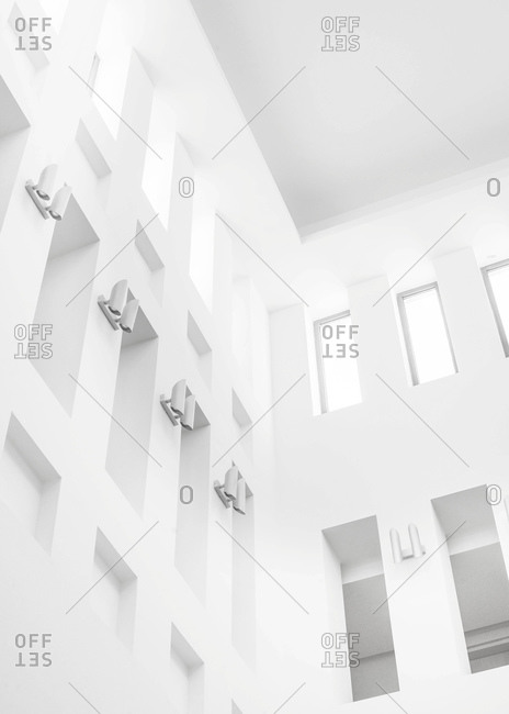 Windows and lights in a building in black and white