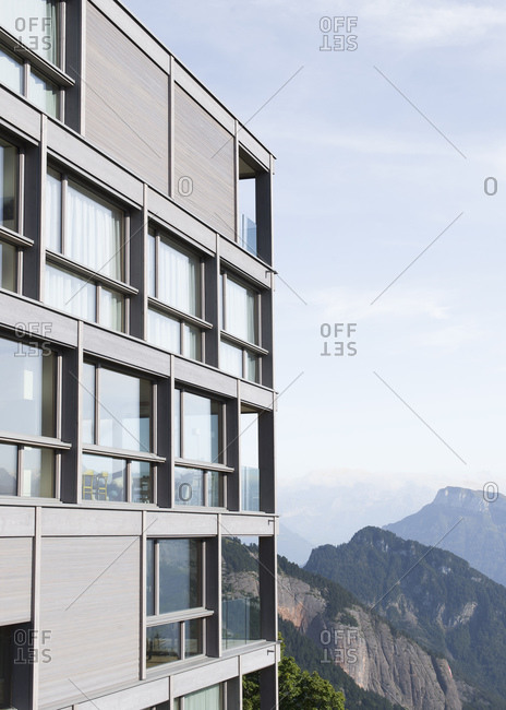 Building with reflections of mountains