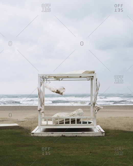 Wooden pergola on a windy beach