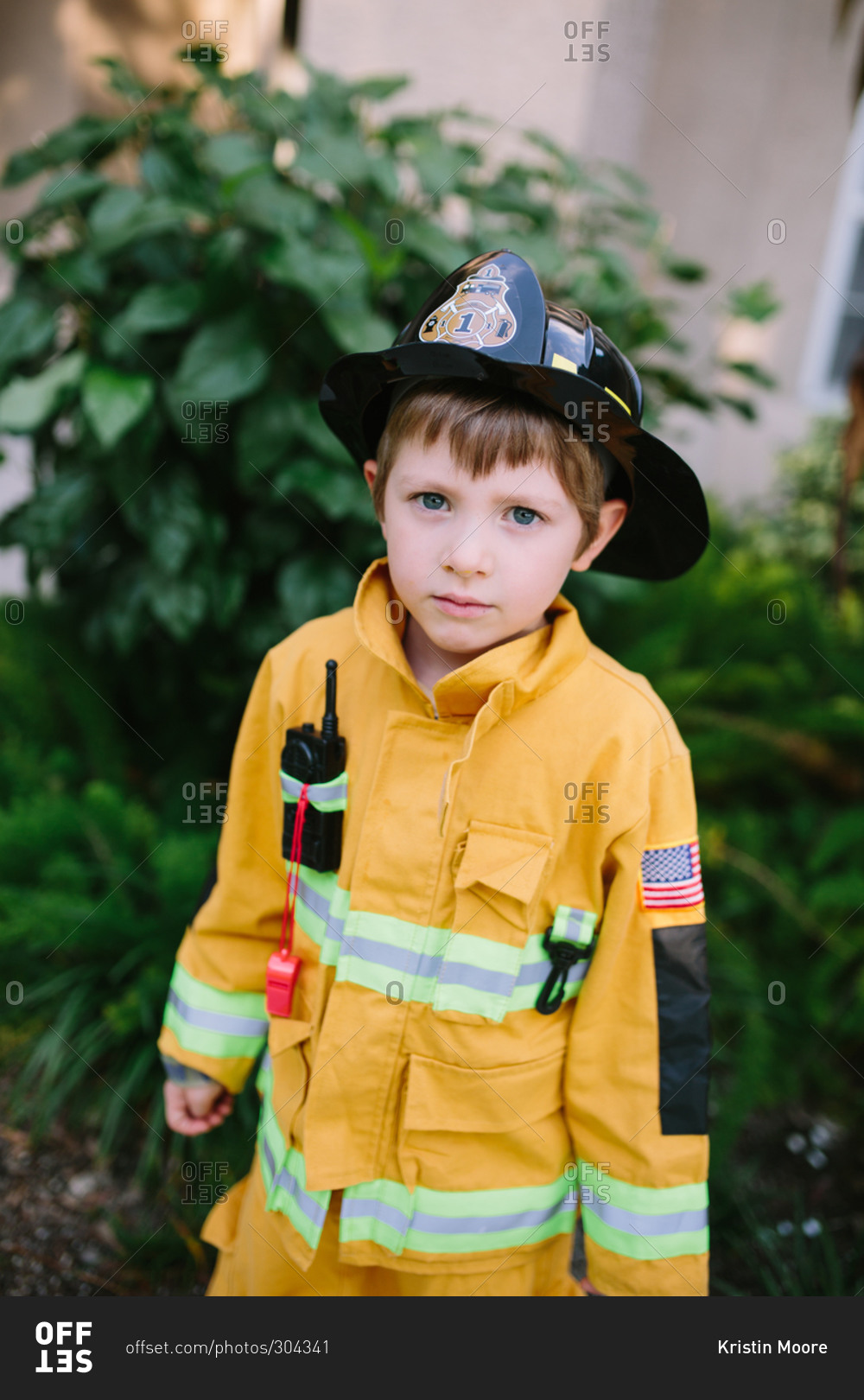 Young boy in fireman costume