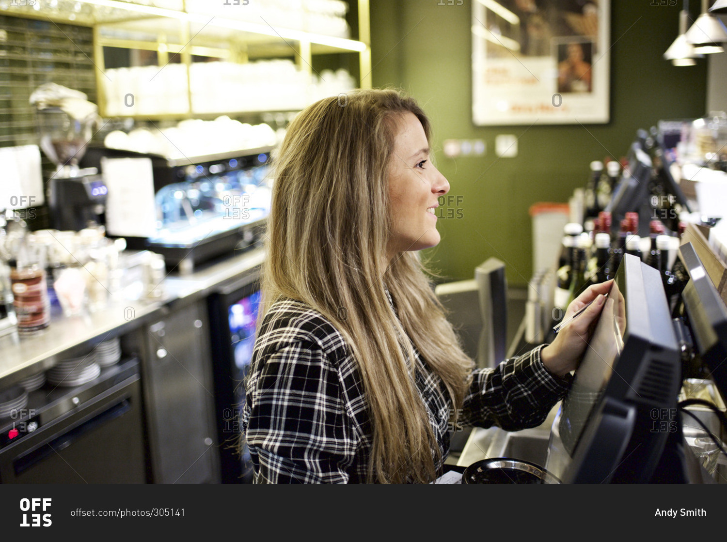 Concession stand worker smiling at register stock photo OFFSET