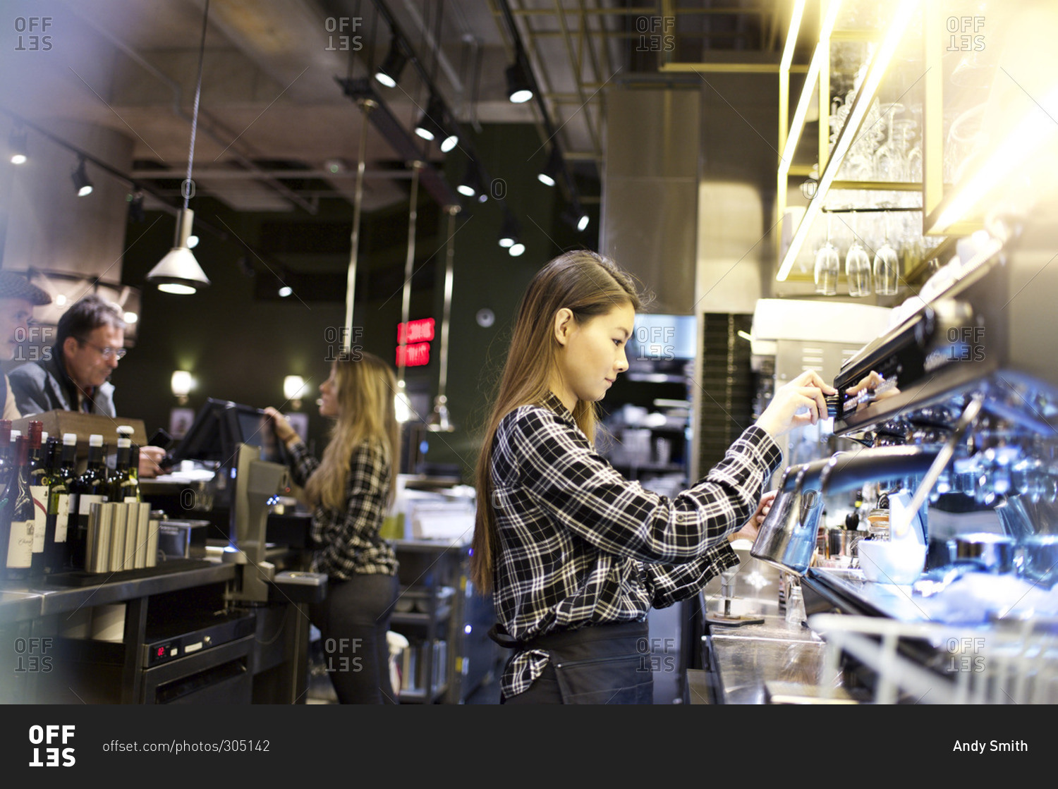 Two theater concession stand workers busy serving customers stock photo