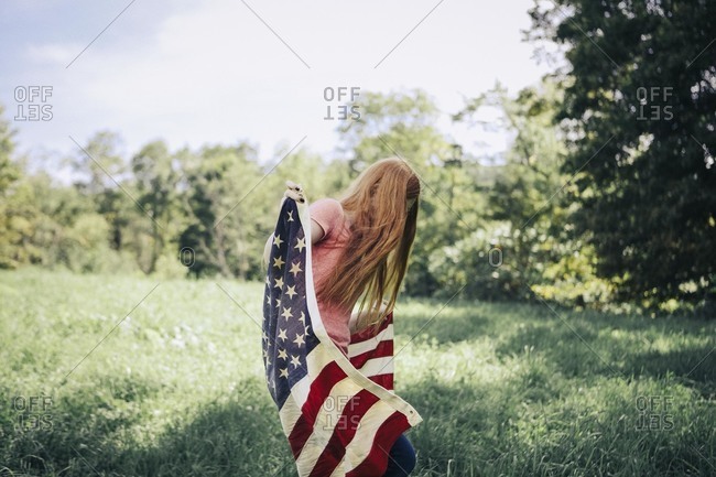 Woman wrapped in American flag