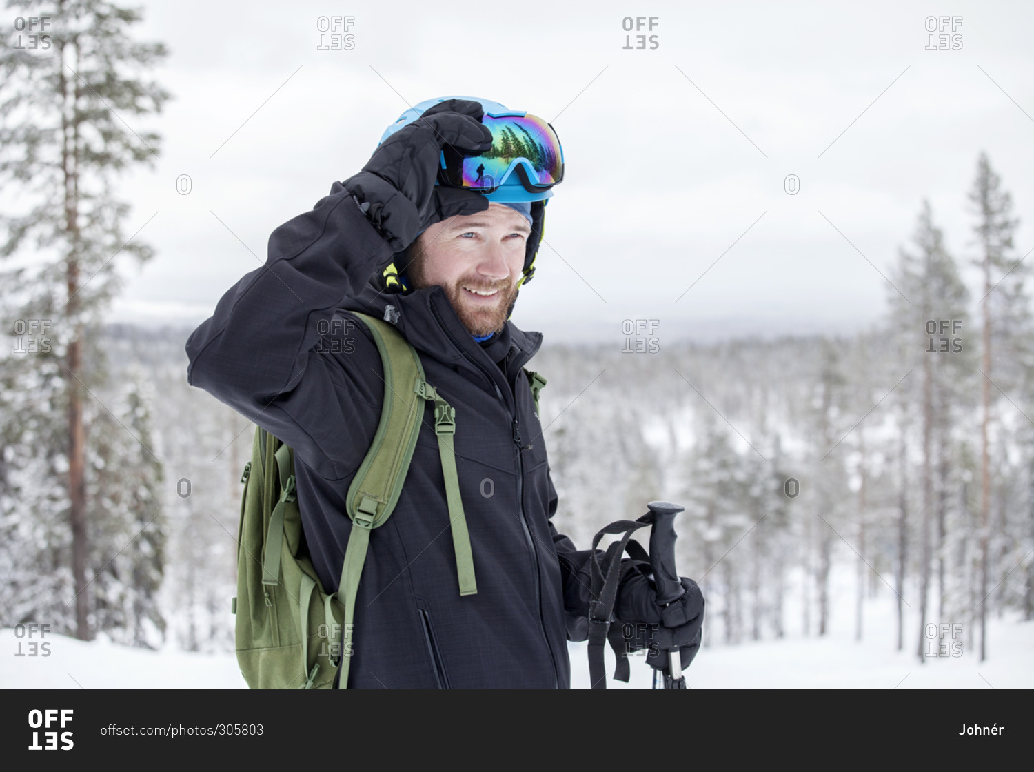 Smiling man skiing