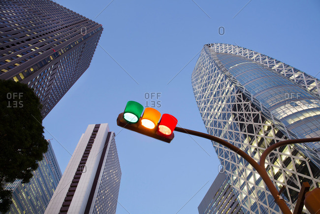 Tokyo, Japan - December 16, 2014: Traffic light and Shinjuku office buildings in Tokyo, Japan