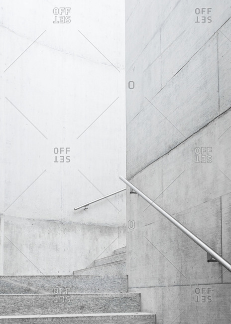 Gray granite stairway with handrails