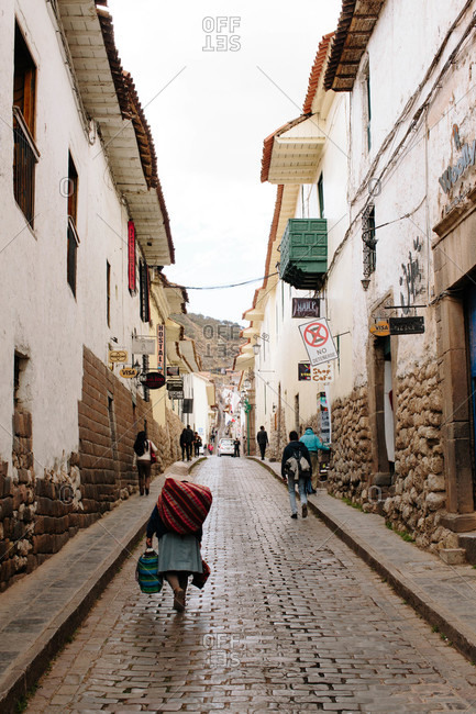 Cusco, Peru - September 3, 32015: Pedestrians on narrow street