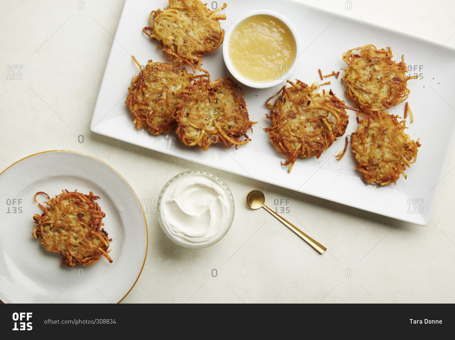 Platter of latkes with applesauce and sour cream