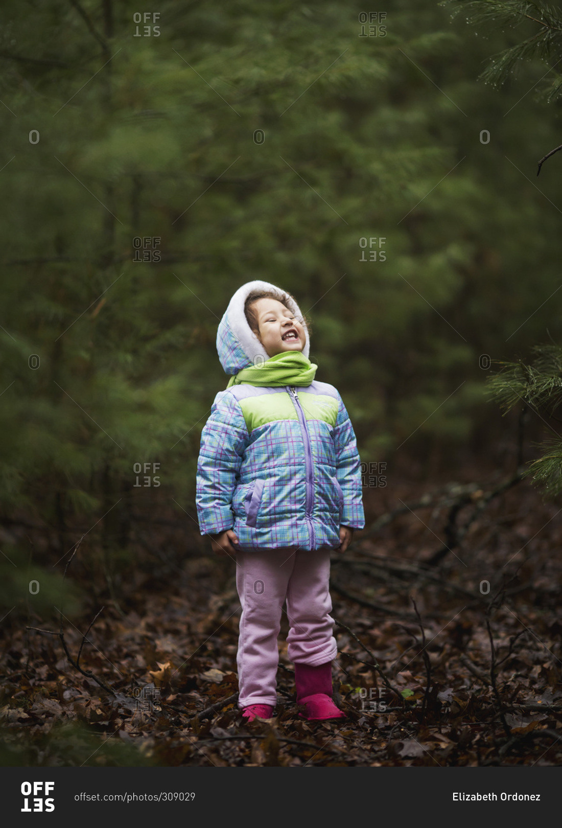 Girl in a forest during damp, chilly weather