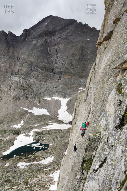 A man and woman rock climbing in Rocky Mountain National Park, Estes Park, Colorado