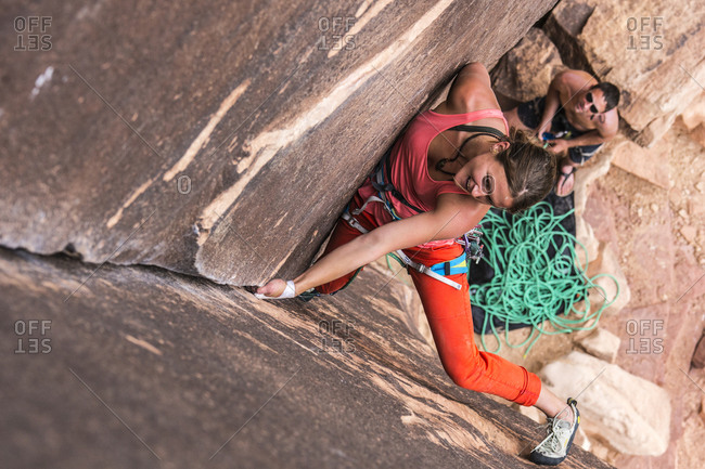 Woman rock climbing in Indian Creek, UT