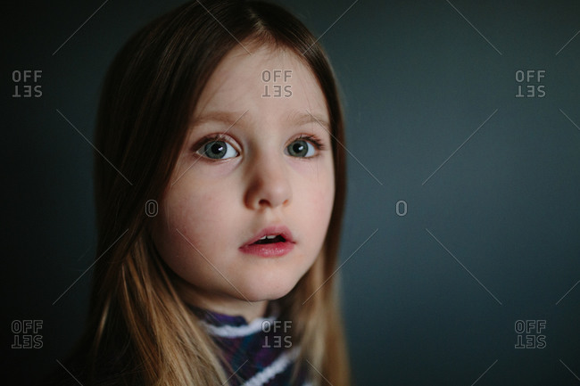 Portrait of a little girl in a high collar dress
