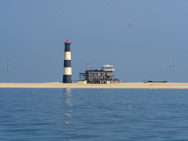 Lighthouse on Pelican Point with Lodge in Walvis Bay Namibia