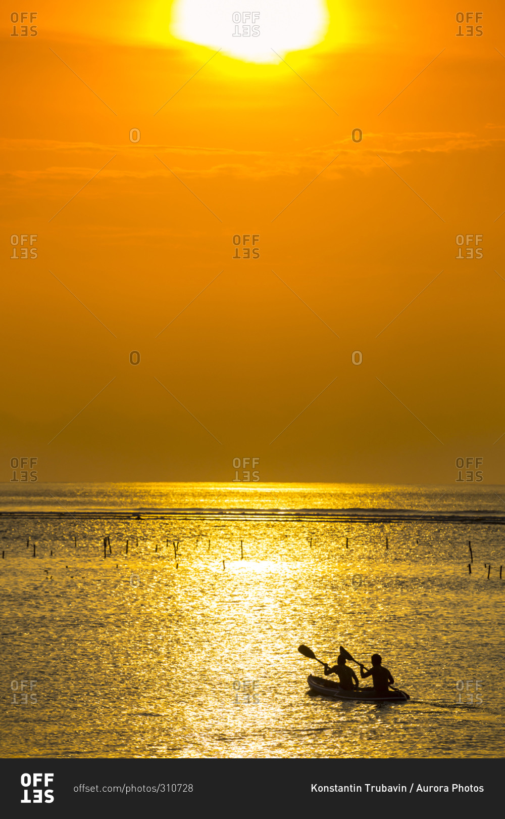 Kayaking at sunset time